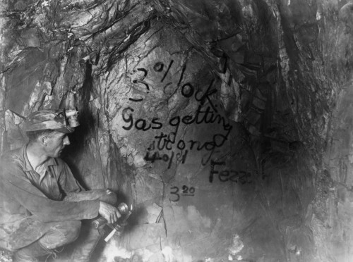 California: Mining, C1922. /Na Miner Looking At The Last Message Left By 47 Entombed Miners On The Side Of A 4,350 Foot Drift In The Argonaut Gold Mine, Jackson, California. Photograph, C1922. Poster Print by Granger Collection - Item # VARGRC0116218