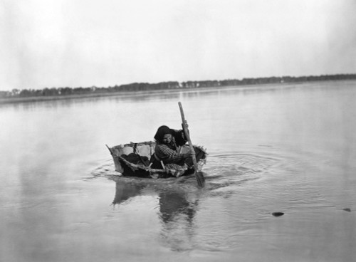 Mandan Bull Boat, C1908. /Na Mandan Native American Woman Paddling A Bull Boat On A River In North Dakota. Photographed By Edward S. Curtis, C1908. Poster Print by Granger Collection - Item # VARGRC0116791