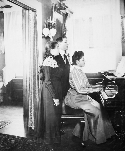 Family Singing, C1900. /Na Turn-Of-The-Century New York Family Rehearses A Tune In The Parlor. Poster Print by Granger Collection - Item # VARGRC0017021
