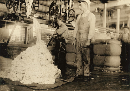 Hine: Child Labor, 1910. /Nboy Using A Warping Machine With A Man Overseeing His Work At The Elk Cotton Mill In Fayetteville, Tennessee. Photograph By Lewis Hine, November 1910. Poster Print by Granger Collection - Item # VARGRC0131859
