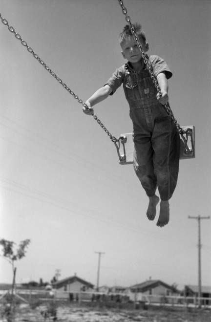 Swing, C1940. /Na Boy On A Swingset. Photograph, C1940. Poster Print by Granger Collection - Item # VARGRC0322255 Swing, C1940. /Na Boy On A Swingset. Photograph, C1940. Poster Print by Granger Collection - Item # VARGRC0322255