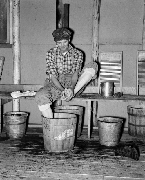 Minnesota: Lumber Camp, 1937. /Na Lumberjack Washing His Feet In A Lumber Camp, Near Effie, Minnesota. Photograph By Russell Lee, September 1937. Poster Print by Granger Collection - Item # VARGRC0118582