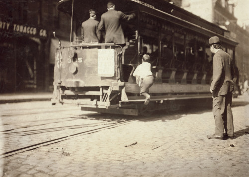 Boston: Newsboy, 1909. /Na Newsboy 'Flipping Cars," On A Trolley In Boston, Massachusetts. Photograph By Lewis Hine, October 1909. Poster Print by Granger Collection - Item # VARGRC0107051