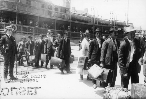 Immigrants, 1920. /Neuropean Immigrants Leaving The Ellis Island Ferry To Arive In The United States, 1920. Poster Print by Granger Collection - Item # VARGRC0125104