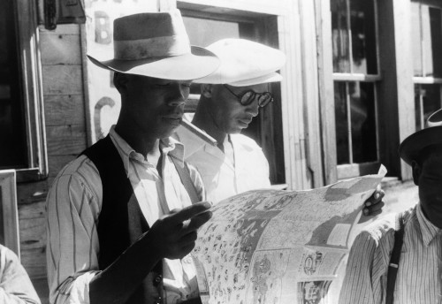 Migrant Workers, 1940. /Nflorida Migrants Studying A Road Map Before Leaving Elizabeth City, North Carolina For The State Of Delaware. Photograph By Jack Delano, July 1940. Poster Print by Granger Collection - Item # VARGRC0122989