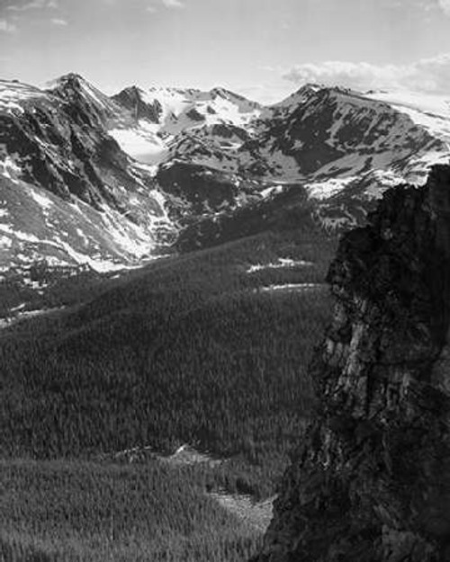 View of snow-capped mountain timbered area below, in Rocky Mountain National Park, Colorado, ca. 194 Poster Print by Ansel Adams - Item # VARPDX460950