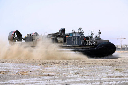 An air-cushion landing craft approaches the shore of Camp Al-Galail, Qatar Poster Print by Stocktrek Images - Item # VARPSTSTK107878M