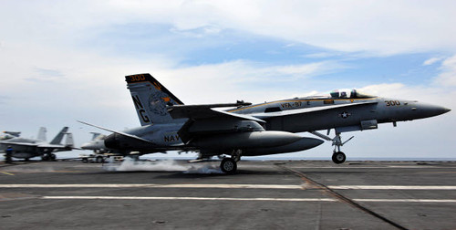 An F/A-18C Hornet lands aboard the Nimitz-class aircraft carrier USS John C Stennis Poster Print by Stocktrek Images - Item # VARPSTSTK104848M