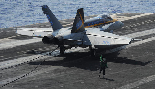 An F/A-18C Hornet lands on the flight deck of USS Nimitz Poster Print by Stocktrek Images - Item # VARPSTSTK107817M