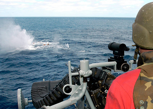 Gunner's Mate fires at target boxes using an MK-38 25mm Machine Gun System Poster Print by Stocktrek Images - Item # VARPSTSTK100554M Gunner's Mate fires at target boxes using an MK-38 25mm Machine Gun System Poster Print by Stocktrek Images - Item # VARPSTSTK100554M