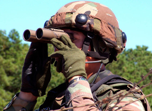 A soldier scans an area for enemy forces Poster Print by Stocktrek Images - Item # VARPSTSTK101562M