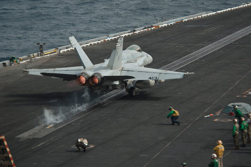 An F/A-18C Hornet launches from the flight deck aboard USS Nimitz Poster Print by Stocktrek Images - Item # VARPSTSTK107684M