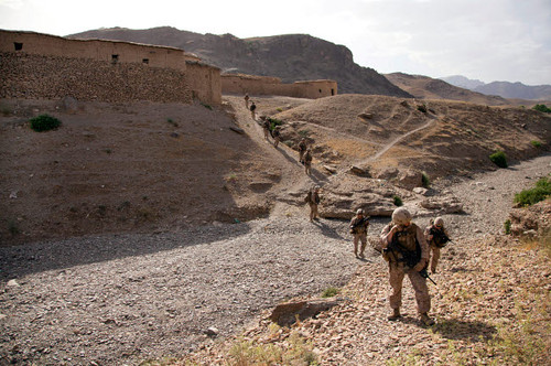 US Marines patrol through a village in Afghanistan Poster Print by Stocktrek Images - Item # VARPSTSTK107902M