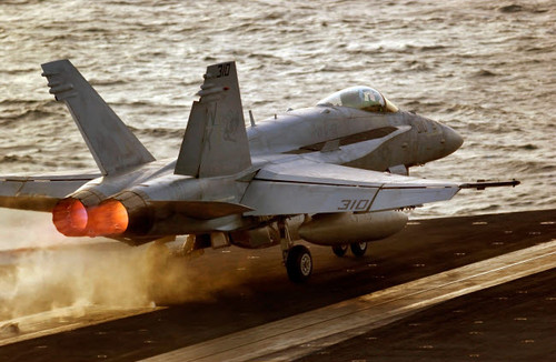 An F/A-18C Hornet launches from the flight deck aboard USS Ronald Reagan Poster Print by Stocktrek Images - Item # VARPSTSTK101228M