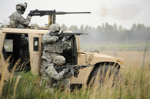 US Soldiers perform a platoon mounted and dismounted live-fire exercise Poster Print by Stocktrek Images - Item # VARPSTSTK103938M