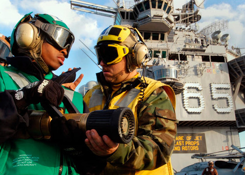 Airman receives proper fire fighting nozzle handling techniques Poster Print by Stocktrek Images - Item # VARPSTSTK100197M