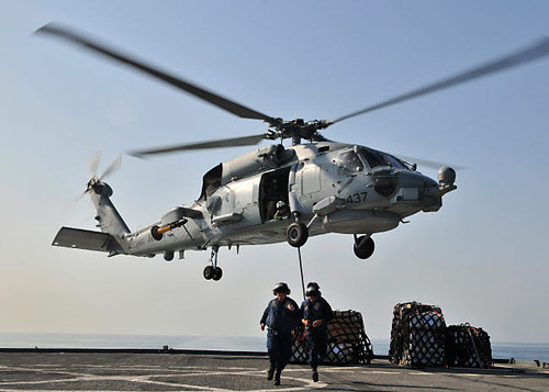 An SH-60F Sea Hawk helicopter picks up supplies from USS Gunston Hall Poster Print by Stocktrek Images - Item # VARPSTSTK106644M