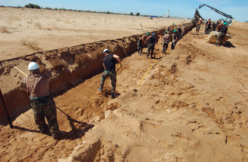 US Air Force Airmen dig a trench Poster Print by Stocktrek Images - Item # VARPSTSTK102281M