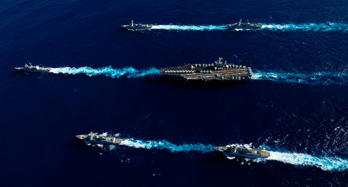 Ships from the John C Stennis Carrier Strike Group transit the Pacific Ocean Poster Print by Stocktrek Images - Item # VARPSTSTK105629M