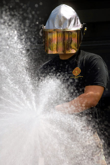 Airman tests a water pump truck Poster Print by Stocktrek Images - Item # VARPSTSTK101553M