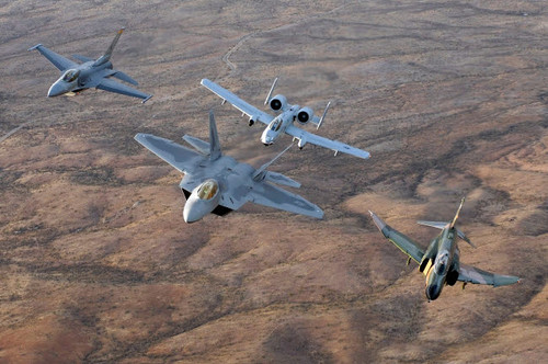 An F-22A Raptor, an F-4 Phantom, an F-16 Fighting Falcon and an A-10 Thunderbolt II in flight Poster Print by Stocktrek Images - Item # VARPSTSTK101240M