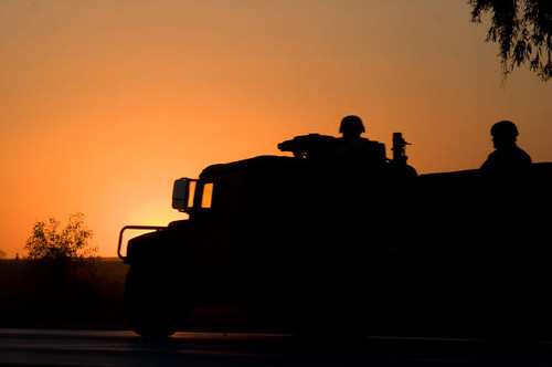 A US Army Humvee with soldiers in the back at sunset Poster Print by Terry Moore/Stocktrek Images - Item # VARPSTTMO100018M