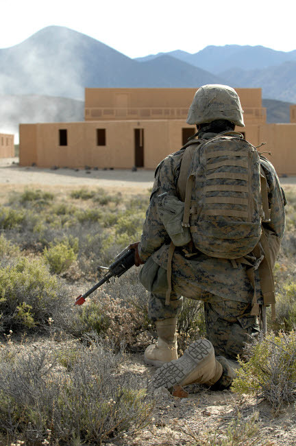 A US Marine watches for simulated insurgents in a military operation on urban terrain Poster Print by Stocktrek Images - Item # VARPSTSTK103767M