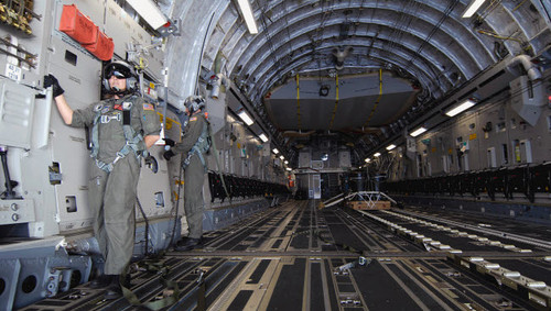 Airmen prepare to drop a practice bundle from a C-17 Globemaster III Poster Print by Stocktrek Images - Item # VARPSTSTK102545M