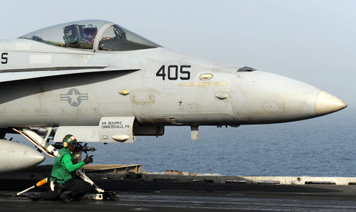 An aviation boatswain's mate guides an F/A-18C Hornet into a catapult Poster Print by Stocktrek Images - Item # VARPSTSTK106482M An aviation boatswain's mate guides an F/A-18C Hornet into a catapult Poster Print by Stocktrek Images - Item # VARPSTSTK106482M