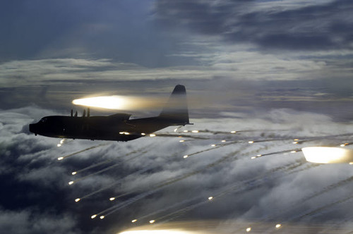MC-130P Combat Shadow dropping flares Poster Print by Gert Kromhout/Stocktrek Images - Item # VARPSTGKR100147M