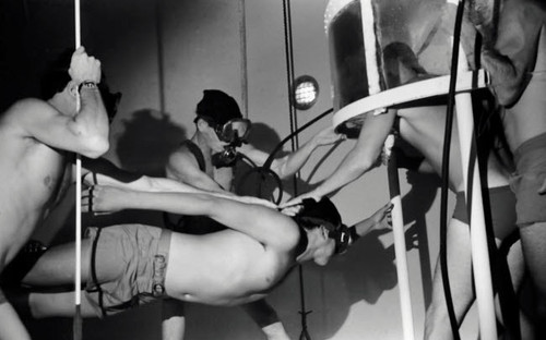 BUD/S dive tower instructors transfer a student from a roving bell in preparation for swimming ascent training Poster Print by Michael Wood/Stocktrek Images - Item # VARPSTWOD100092M