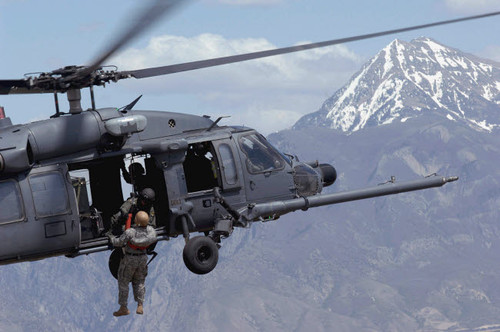 A soldier is lifted on board an Air Force HH-60 Pave Hawk Poster Print by Stocktrek Images - Item # VARPSTSTK102441M A soldier is lifted on board an Air Force HH-60 Pave Hawk Poster Print by Stocktrek Images - Item # VARPSTSTK102441M