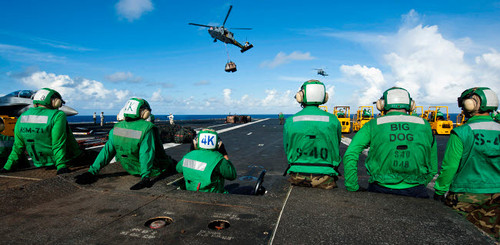 Logistics specialists stand by as an MH-60S Sea Hawk delivers supplies Poster Print by Stocktrek Images - Item # VARPSTSTK106496M Logistics specialists stand by as an MH-60S Sea Hawk delivers supplies Poster Print by Stocktrek Images - Item # VARPSTSTK106496M