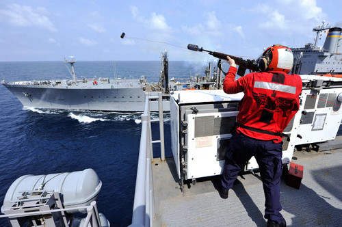 Airman fires a shot line from USS Bonhomme Richard Poster Print by Stocktrek Images - Item # VARPSTSTK106829M