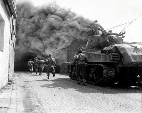 Soldiers move through a smoke filled street, Wernberg, Germany Poster Print by Stocktrek Images - Item # VARPSTSTK104516M