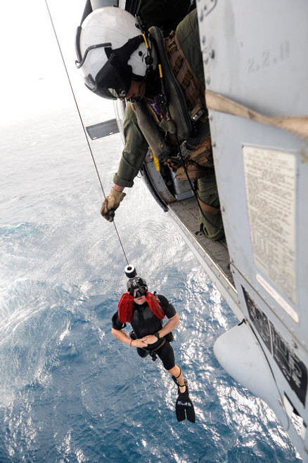 Aircrewman assists in hoisting a member into an MH-60S Sea Hawk Poster Print by Stocktrek Images - Item # VARPSTSTK107797M Aircrewman assists in hoisting a member into an MH-60S Sea Hawk Poster Print by Stocktrek Images - Item # VARPSTSTK107797M