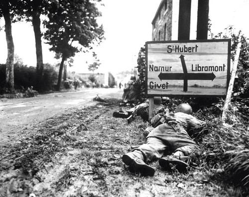 Infantrymen seek cover during a firefight in Libin, Belgium, during WWII Poster Print by Stocktrek Images - Item # VARPSTSTK106023M