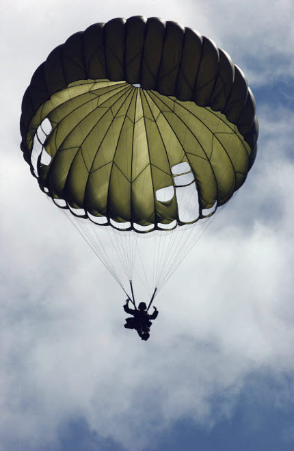 An Armed Forces of the Philippines paratrooper wearing an MC1-C parachute descends through the sky Poster Print by Stocktrek Images - Item # VARPSTSTK102214M An Armed Forces of the Philippines paratrooper wearing an MC1-C parachute descends through the sky Poster Print by Stocktrek Images - Item # VARPSTSTK102214M