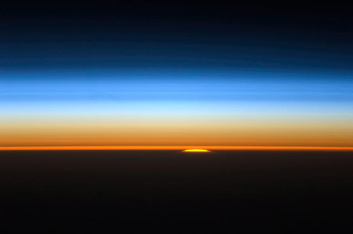 View of the sun peeking over the limb of the Earth Poster Print by Stocktrek Images - Item # VARPSTSTK204533S