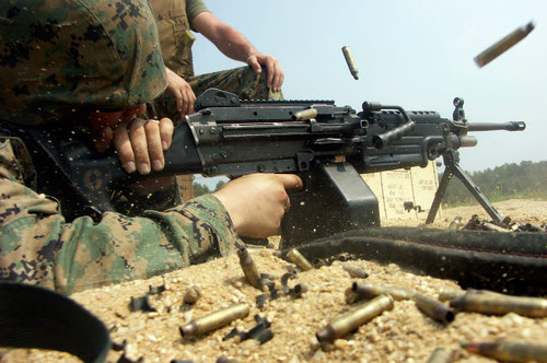 A Marine engages targets with an M-249 Squad Automatic Weapon Poster Print by Stocktrek Images - Item # VARPSTSTK102044M