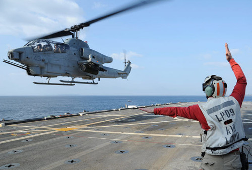 An AH-1W Cobra helicopter takes off from USS Denver Poster Print by Stocktrek Images - Item # VARPSTSTK105873M