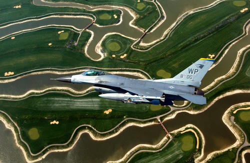 An F-16 Fighting Falcon flies near base Poster Print by Stocktrek Images - Item # VARPSTSTK101452M