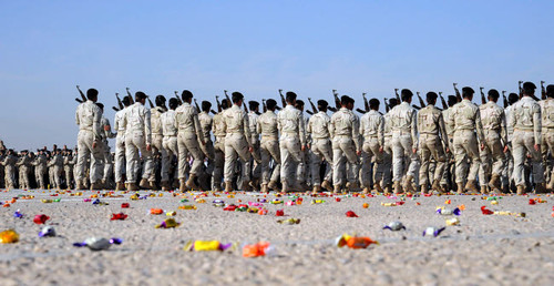 Candy covers the parade grounds during a pass in review at an Iraqi Air Force officer graduation ceremony Poster Print by Stocktrek Images - Item # VARPSTSTK103411M