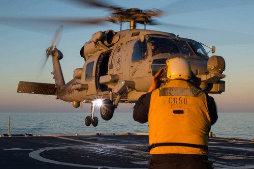 Boatswain's Mate guides an MH-60R Sea Hawk onto the flight deck Poster Print by Stocktrek Images - Item # VARPSTSTK108168M Boatswain's Mate guides an MH-60R Sea Hawk onto the flight deck Poster Print by Stocktrek Images - Item # VARPSTSTK108168M