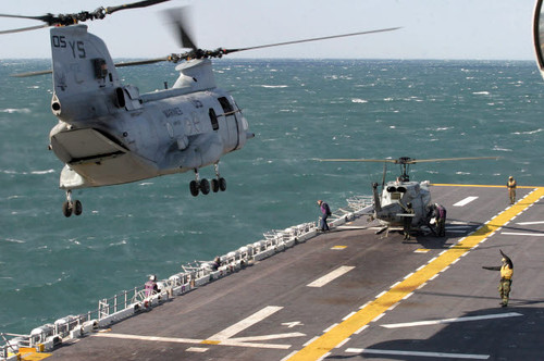 A CH-46E Sea Knight helicopter prepares to land on the flight deck aboard USS Kearsarge Poster Print by Stocktrek Images - Item # VARPSTSTK100758M