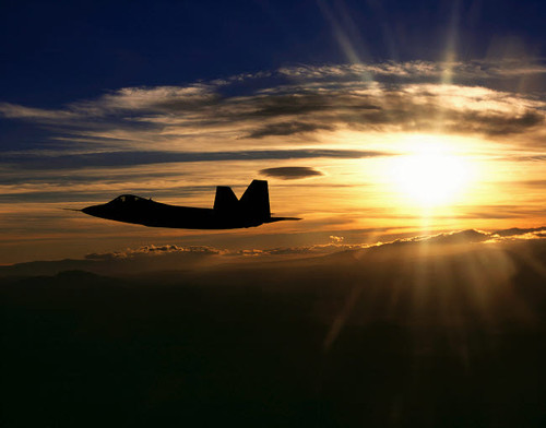 An F/A-22 Raptor flies a training mission at sunset Poster Print by Stocktrek Images - Item # VARPSTSTK100278M