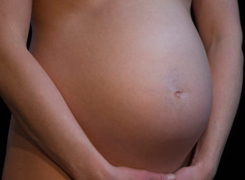 Midsection of a pregnant woman Poster Print by VWPics/Stocktrek Images - Item # VARPSTVWP700279H