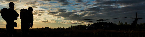 Paratroopers wait to board a UH-60 Black Hawk for a jump exercise Poster Print by Stocktrek Images - Item # VARPSTSTK108523M