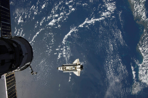 Space Shuttle Endeavour backdropped by a blue and white Earth Poster Print by Stocktrek Images - Item # VARPSTSTK201853S