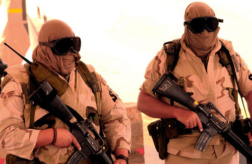Airmen guard an entry control point during a sandstorm Poster Print by Stocktrek Images - Item # VARPSTSTK101087M
